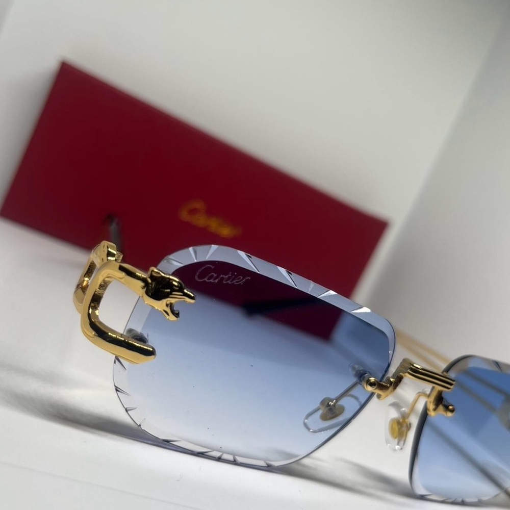 Cartier men’s Sunglasses with Light Blue Lenses and Gold Accents